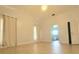 Spacious main bedroom with light tile flooring and ensuite bathroom access at 283 Pine Arbor Dr, Orlando, FL 32825