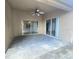 Covered patio area features sliding glass doors to the interior at 283 Pine Arbor Dr, Orlando, FL 32825