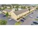 Aerial view of the attractive townhome community with a pond, fountain and ample parking at 2855 Club Cortile Cir, Kissimmee, FL 34746