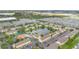 A high-angle aerial view of the townhome community, revealing its expansive layout at 2855 Club Cortile Cir, Kissimmee, FL 34746