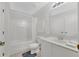 Bright bathroom featuring a shower-tub combo and a single sink vanity at 2855 Club Cortile Cir, Kissimmee, FL 34746