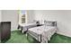 Bedroom with two twin beds, window, and plush carpeting, illuminated by natural light at 2855 Club Cortile Cir, Kissimmee, FL 34746