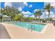 Community pool with lounge chairs and plenty of space to relax and enjoy the sun at 2855 Club Cortile Cir, Kissimmee, FL 34746