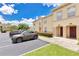 Well-maintained townhome complex, with ample parking and lush landscaping at 2855 Club Cortile Cir, Kissimmee, FL 34746