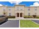 Inviting townhome with manicured landscaping, neutral paint, and convenient parking at 2855 Club Cortile Cir, Kissimmee, FL 34746