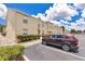 Well-kept townhome with ample parking space, with manicured landscaping at 2855 Club Cortile Cir, Kissimmee, FL 34746