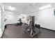 Fitness room with exercise machines, mirrors, and ceiling fans at 2855 Club Cortile Cir, Kissimmee, FL 34746