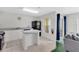 Functional kitchen features an island, white cabinetry, and black appliances at 2855 Club Cortile Cir, Kissimmee, FL 34746