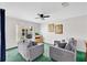 Comfortable living room, featuring neutral colors, plush seating, and bright natural light at 2855 Club Cortile Cir, Kissimmee, FL 34746