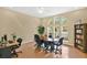 Office space featuring multiple windows, desk space, chairs, and a bookcase at 2855 Club Cortile Cir, Kissimmee, FL 34746