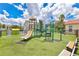 A safe and fun playground for children, complete with slides, climbing structures, and benches at 2855 Club Cortile Cir, Kissimmee, FL 34746