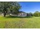 Well-maintained lawn and screened-in patio area perfect for enjoying the outdoors in this charming home at 305 Grand Reserve Dr, Davenport, FL 33837