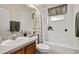 Clean bathroom with white tile, a combination shower/tub, and a wood vanity at 305 Grand Reserve Dr, Davenport, FL 33837