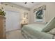 Relaxing bedroom with neutral tones, double closet, and natural light at 305 Grand Reserve Dr, Davenport, FL 33837