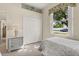 Comfortable bedroom featuring a single bed, closet, and bright window at 305 Grand Reserve Dr, Davenport, FL 33837