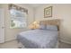Bedroom featuring neutral tones, carpet, large bed, and bright window at 305 Grand Reserve Dr, Davenport, FL 33837