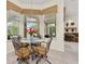 Bright breakfast nook with views of the pool and lanai at 305 Grand Reserve Dr, Davenport, FL 33837
