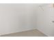 Empty walk-in closet with neutral carpeting, wire shelving, and painted walls at 305 Grand Reserve Dr, Davenport, FL 33837