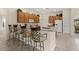 Kitchen with a breakfast bar, pendant lighting and stainless-steel appliances at 305 Grand Reserve Dr, Davenport, FL 33837