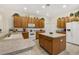Bright kitchen with wooden cabinets and tiled floor at 305 Grand Reserve Dr, Davenport, FL 33837