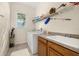 Bright laundry room with sink and storage at 305 Grand Reserve Dr, Davenport, FL 33837