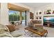Inviting living room with outdoor views, recessed alcoves, and a large coffee table at 305 Grand Reserve Dr, Davenport, FL 33837