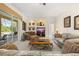 Spacious living room with large windows, recessed alcoves, and comfortable seating at 305 Grand Reserve Dr, Davenport, FL 33837