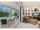 Comfortable living room with access to the screened-in patio and views of the pool at 305 Grand Reserve Dr, Davenport, FL 33837