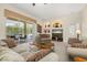 Well-lit living room with recessed lighting, comfortable sofas and a view of the pool at 305 Grand Reserve Dr, Davenport, FL 33837