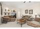 Cozy living room with comfortable sofas, recessed shelves, and a ceiling fan at 305 Grand Reserve Dr, Davenport, FL 33837