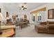 Expansive living room flows into the kitchen and offers views of the outdoor patio at 305 Grand Reserve Dr, Davenport, FL 33837
