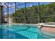 Close-up of the sparkling pool water and spa, offering a tranquil and refreshing outdoor experience at 305 Grand Reserve Dr, Davenport, FL 33837