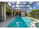 Beautiful pool with a screened enclosure, seamlessly blending indoor and outdoor living at 305 Grand Reserve Dr, Davenport, FL 33837