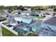Stunning aerial view of the home's backyard, showcasing the screened pool and outdoor space at 336 Hollingshead Loop, Davenport, FL 33896
