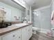 Bright bathroom with a shower, toilet and a sink with vanity at 336 Hollingshead Loop, Davenport, FL 33896