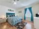 Inviting bedroom featuring a ceiling fan, vibrant decor, and a cozy area rug at 336 Hollingshead Loop, Davenport, FL 33896