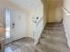 Inviting entryway with a staircase, wood-look flooring, and a front door at 336 Hollingshead Loop, Davenport, FL 33896