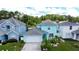 Charming two-story home with a well-maintained lawn and lush landscaping at 336 Hollingshead Loop, Davenport, FL 33896
