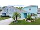 Well-manicured lawn highlights this charming two-story home with mature landscaping at 336 Hollingshead Loop, Davenport, FL 33896