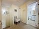 Upstairs hallway with chair, showing views of closet and bathroom at 336 Hollingshead Loop, Davenport, FL 33896