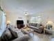 Spacious living room with comfortable couches, large TV, and ample natural light at 336 Hollingshead Loop, Davenport, FL 33896