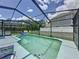Inviting screened-in pool area with comfortable lounge chairs and a clear view of the backyard and fence at 336 Hollingshead Loop, Davenport, FL 33896