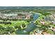 Gorgeous aerial view of a golf course community with water features and lush landscaping at 346 Treviso Dr, Kissimmee, FL 34759