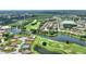 Serene aerial of a golf course home near a lake and neighborhood at 346 Treviso Dr, Kissimmee, FL 34759
