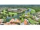 Fantastic aerial view of a community near a lake, golf course, and amenities at 346 Treviso Dr, Kissimmee, FL 34759