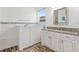 Bright bathroom features wood-look tile, granite counters, and a walk-in tub at 346 Treviso Dr, Kissimmee, FL 34759