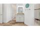 Bright bathroom features wood-look tile, granite counters, and a walk-in shower at 346 Treviso Dr, Kissimmee, FL 34759