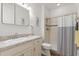 Bathroom featuring a single sink vanity with tiled shower and tub at 346 Treviso Dr, Kissimmee, FL 34759