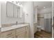 Bright bathroom featuring a single sink vanity and tiled shower with tub at 346 Treviso Dr, Kissimmee, FL 34759