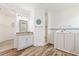 Spacious bathroom features wood-look tile, granite counters, and a walk-in tub at 346 Treviso Dr, Kissimmee, FL 34759
